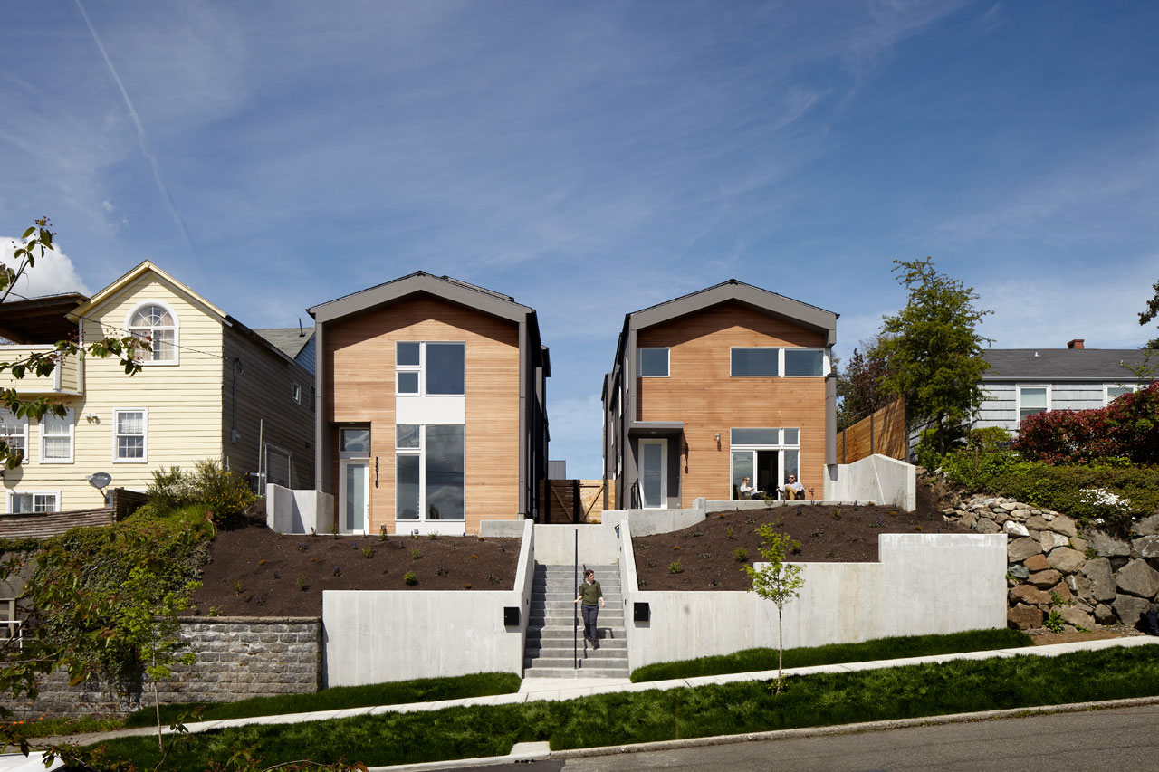 2 light wood single family homes next to each other
